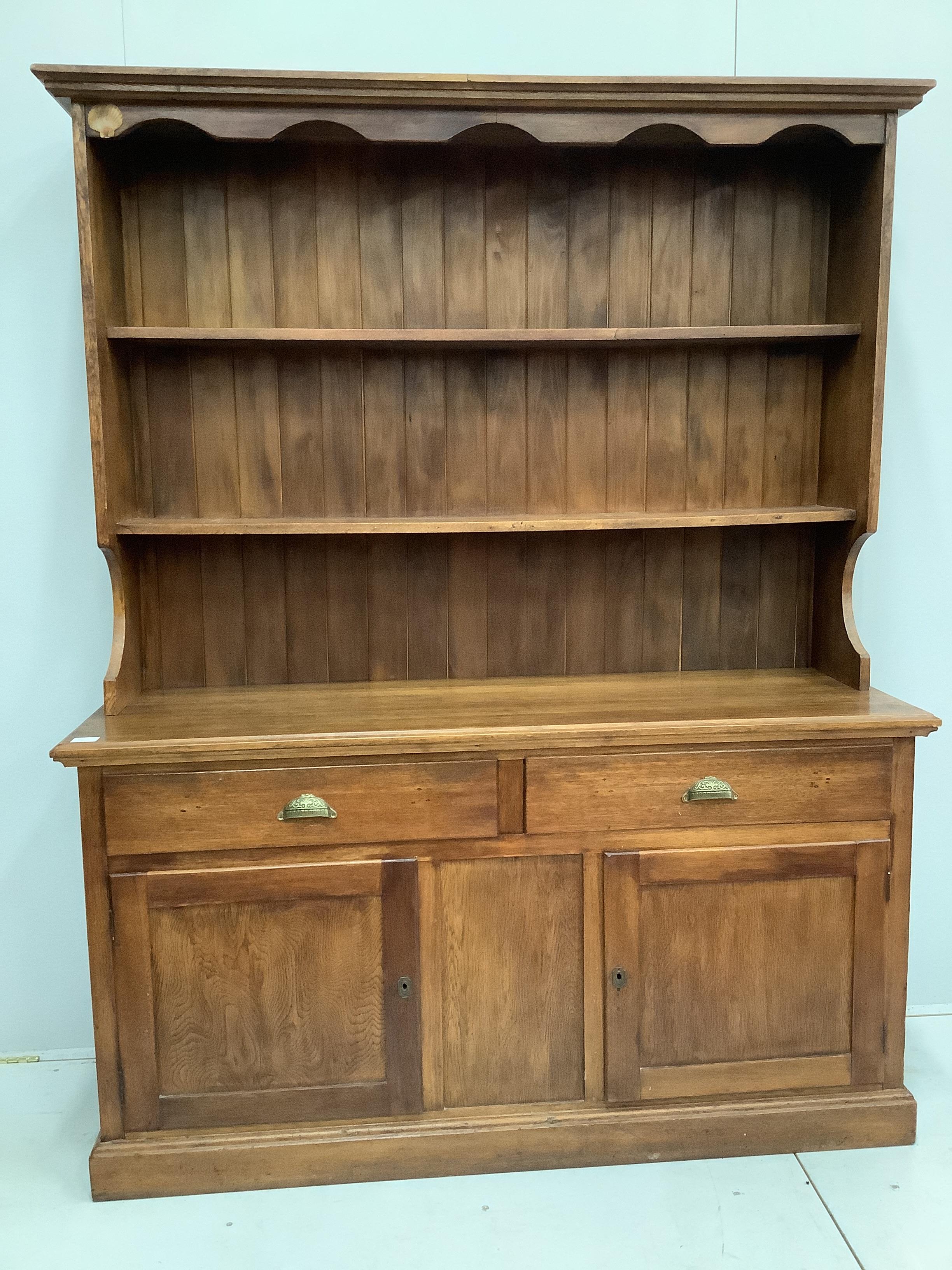 A Continental hardwood oak dresser and rack, width 152cm, depth 48cm, height 192cm